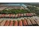Aerial view of a community with houses near a lake at 125 Soliera St, Nokomis, FL 34275