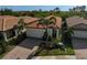 Aerial view of single-Gathering home with tile roof and landscaped yard at 125 Soliera St, Nokomis, FL 34275