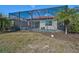Spacious backyard with a screened-in pool and spa at 125 Soliera St, Nokomis, FL 34275