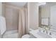 Clean bathroom with a bathtub, shower, and vanity at 125 Soliera St, Nokomis, FL 34275