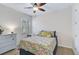 Bright bedroom featuring a full bed and ceiling fan at 125 Soliera St, Nokomis, FL 34275