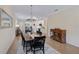Spacious dining area with farmhouse table, view into kitchen and living room at 125 Soliera St, Nokomis, FL 34275