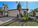 Single-story home with attached garage and landscaped front yard at 125 Soliera St, Nokomis, FL 34275