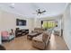 Relaxing living room with reclining sofas and sliding doors to backyard at 125 Soliera St, Nokomis, FL 34275