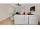 Bright living room with neutral-toned furniture and wood-look tile flooring at 125 Soliera St, Nokomis, FL 34275