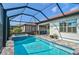 Luxury screened pool and spa with a relaxing patio at 125 Soliera St, Nokomis, FL 34275