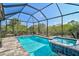 Inviting screened pool and spa with a spacious deck at 125 Soliera St, Nokomis, FL 34275