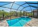 Enjoy this refreshing screened pool and spa at 125 Soliera St, Nokomis, FL 34275