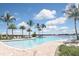 Resort-style pool with lake views and lounge chairs at 125 Soliera St, Nokomis, FL 34275