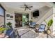 Relaxing sunroom with comfortable seating and a view of the backyard at 125 Soliera St, Nokomis, FL 34275