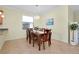 Dining room with hardwood floors and a six-person table at 12704 Richezza Dr, Venice, FL 34293