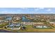 Beautiful aerial view of a Primary-planned community with lakes, lush landscaping, and resort-style amenities at 12837 Oriago St, Venice, FL 34293