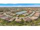 Stunning aerial view of a Primary-planned community surrounding a serene lake with lush green spaces at 12837 Oriago St, Venice, FL 34293