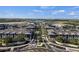 Aerial view of community featuring lake and residential buildings at 12837 Oriago St, Venice, FL 34293