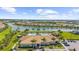 Community clubhouse and pool with lake view at 12837 Oriago St, Venice, FL 34293