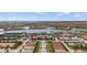 Breathtaking aerial view of the community with its expansive lake, clubhouse, and meticulously planned residences at 12837 Oriago St, Venice, FL 34293
