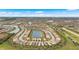 Panoramic aerial shot showcasing a large-scale community with numerous lakes, manicured lawns, and winding roads at 12837 Oriago St, Venice, FL 34293