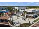 Appealing commercial area with modern buildings, palm trees, outdoor seating, and brick walkways at 12837 Oriago St, Venice, FL 34293