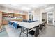 Bright and spacious craft room featuring ample table space and organized storage for creative activities at 12837 Oriago St, Venice, FL 34293