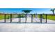 Dog park entrance with separate sections for big and little dogs, and covered seating area at 12837 Oriago St, Venice, FL 34293