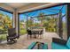 Enclosed patio with hot tub and seating area at 12837 Oriago St, Venice, FL 34293