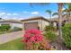 Brick paver driveway and walkway leading to a charming house with bougainvillea at 12837 Oriago St, Venice, FL 34293