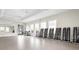 Bright fitness center featuring multiple windows, weight racks, and a mirrored wall for exercise at 12837 Oriago St, Venice, FL 34293