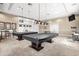 Spacious game room featuring pool tables, ping pong, and decorative lighting at 12837 Oriago St, Venice, FL 34293