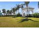 Picturesque gazebo surrounded by lush greenery and palm trees, perfect for relaxation at 12837 Oriago St, Venice, FL 34293