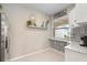 Bright kitchen with white cabinets and patterned backsplash at 12837 Oriago St, Venice, FL 34293