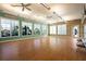 Bright meeting room with large windows providing ample natural light and views of the lush landscaping at 12837 Oriago St, Venice, FL 34293