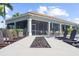 Relaxing outdoor seating area with Adirondack chairs and fire pit, perfect for enjoying the outdoors at 12837 Oriago St, Venice, FL 34293