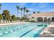 Beautiful community pool with swimming lanes, lounge chairs, and nearby clubhouse at 12837 Oriago St, Venice, FL 34293