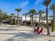 Outdoor space with palm trees, hammocks, and red chairs at 12837 Oriago St, Venice, FL 34293