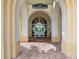 Entrance to the Islandwalk Resort Center, featuring arched walkways and a glass door at 12837 Oriago St, Venice, FL 34293