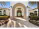 Beautifully landscaped entrance to the resort center with arched entryway at 12837 Oriago St, Venice, FL 34293