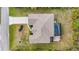 Aerial view showing house, pool, and landscaping at 13156 Dodds Ct, Port Charlotte, FL 33953