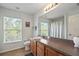 Clean bathroom with vanity, toilet, and shower/tub combo at 13156 Dodds Ct, Port Charlotte, FL 33953