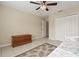 Bedroom with daybed, ceiling fan, and lots of closet space at 13156 Dodds Ct, Port Charlotte, FL 33953