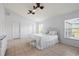 Spacious bedroom with king-size bed, tiled floors, and large windows at 13156 Dodds Ct, Port Charlotte, FL 33953
