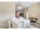 Dining room features a chandelier and white table at 13156 Dodds Ct, Port Charlotte, FL 33953