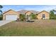 Attractive single-story house with a large front yard and attached garage at 13156 Dodds Ct, Port Charlotte, FL 33953