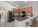 Modern kitchen with granite countertops, stainless steel appliances, and breakfast bar at 13156 Dodds Ct, Port Charlotte, FL 33953