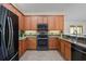 Modern kitchen with stainless steel appliances and granite countertops at 13156 Dodds Ct, Port Charlotte, FL 33953