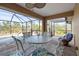 Covered lanai with pool view and comfortable seating at 13156 Dodds Ct, Port Charlotte, FL 33953