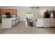 Open living room with tile floors and off-white sofa at 13156 Dodds Ct, Port Charlotte, FL 33953