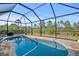 Relaxing screened-in pool with a spacious patio area at 13156 Dodds Ct, Port Charlotte, FL 33953