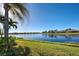 Serene backyard view overlooking a peaceful lake at 13253 Ipolita St, Venice, FL 34293