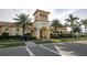 Community clubhouse with a grand entrance and landscaping at 13253 Ipolita St, Venice, FL 34293