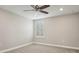 Bright bedroom with ceiling fan and window shutters at 13280 Esposito St, Venice, FL 34293